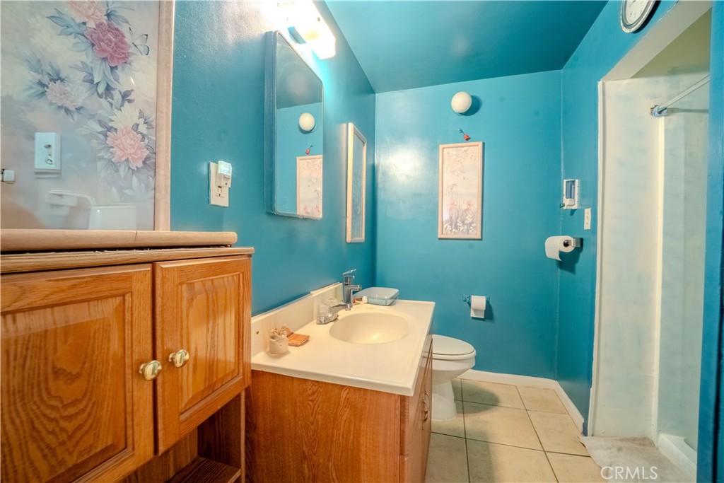 1101 Atlantic Avenue Long Beach, CA 90813 - Photo 15 of 15 a bathroom with a sink a toilet and mirror