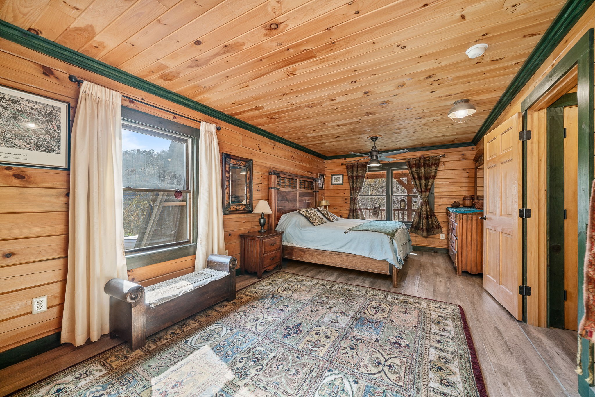 2087 Add Stafford Road Hilham, TN 38568 - Photo 11 of 43 a bedroom with furniture and a large window