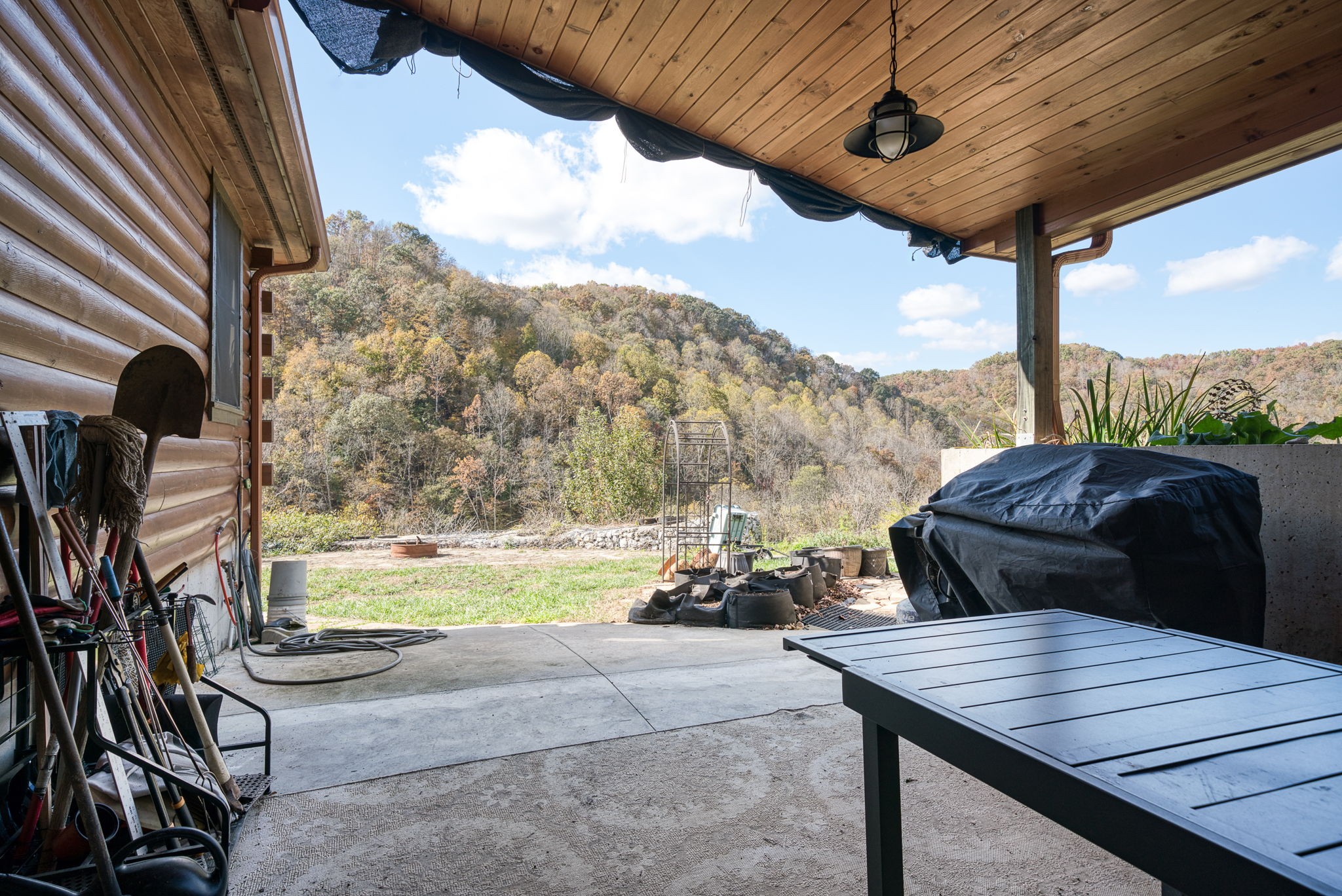 2087 Add Stafford Road Hilham, TN 38568 - Photo 14 of 43 a view of a balcony with table and chairs