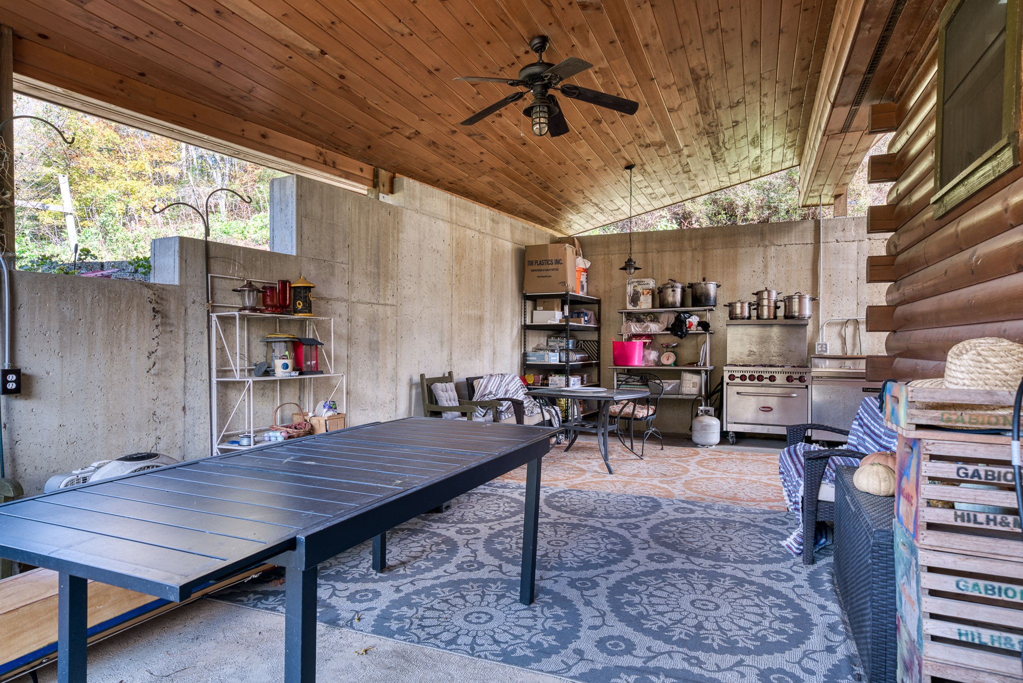 2087 Add Stafford Road Hilham, TN 38568 - Photo 15 of 43 a living room with lots of wooden furniture and a chandelier