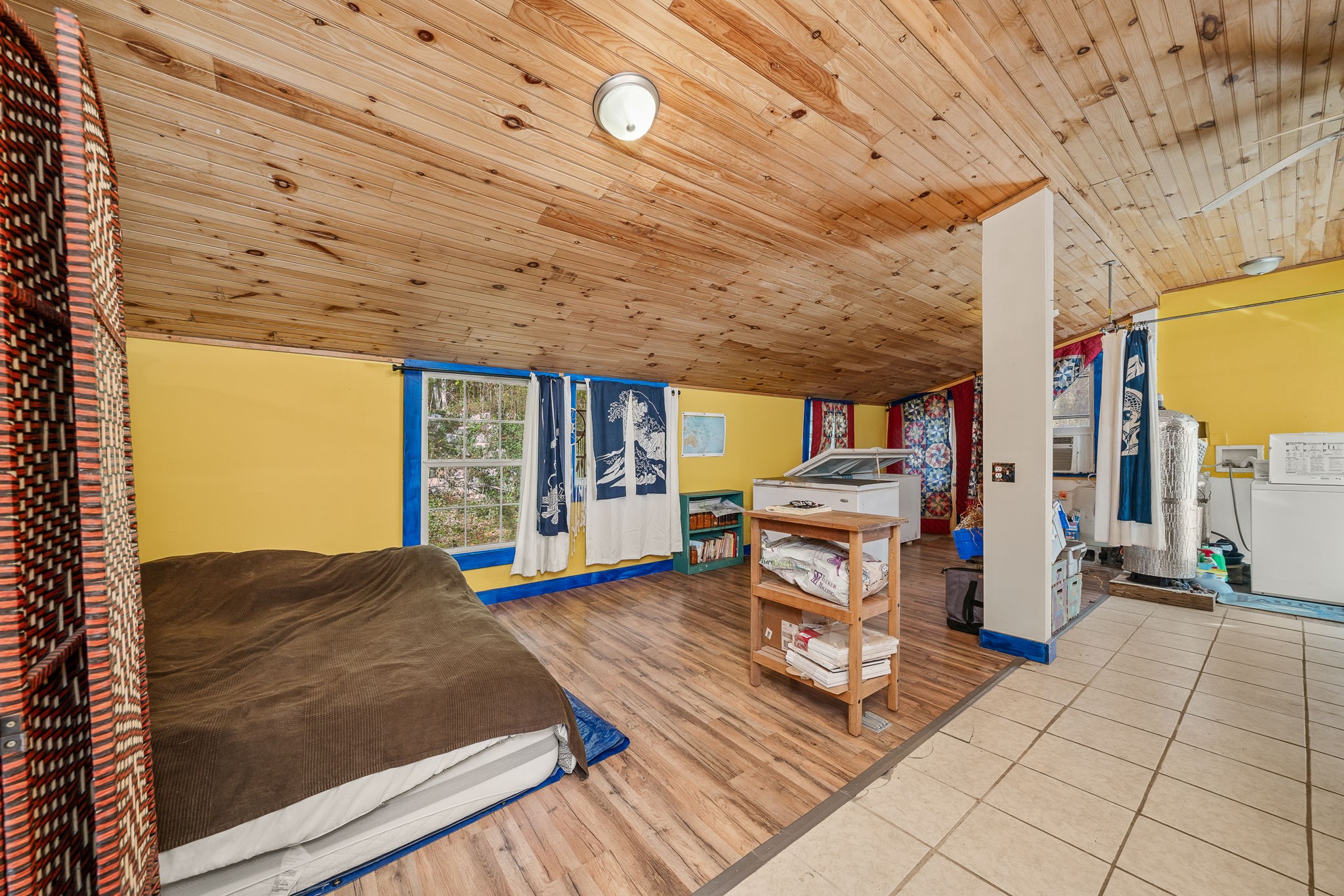 2087 Add Stafford Road Hilham, TN 38568 - Photo 20 of 43 a living room with furniture a flat screen tv and floor to ceiling window