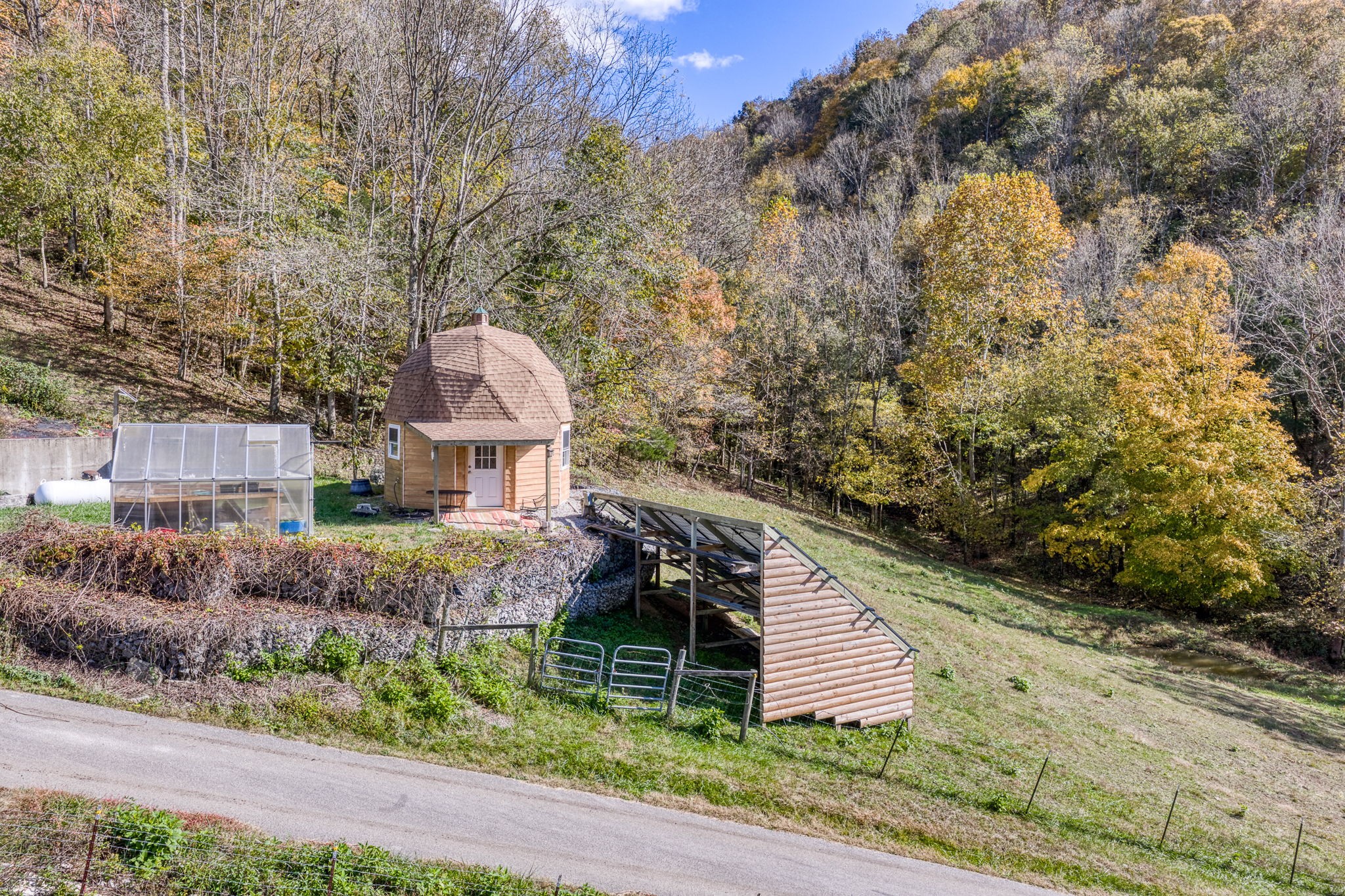 2087 Add Stafford Road Hilham, TN 38568 - Photo 38 of 43 a front view of a house with a yard and large tree
