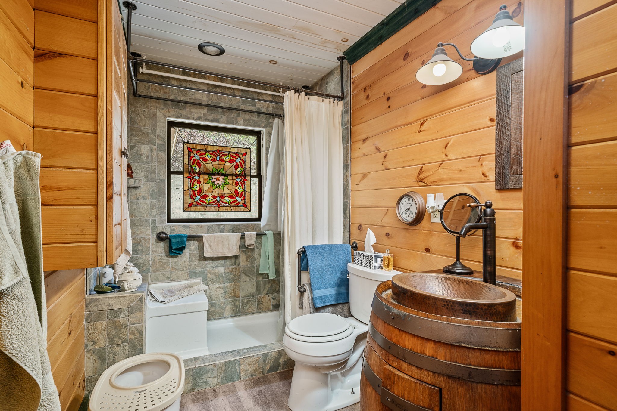 2087 Add Stafford Road Hilham, TN 38568 - Photo 10 of 43 a bathroom with a toilet a sink and mirror