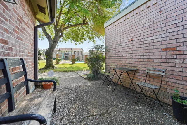 a view of a bench in the backyard