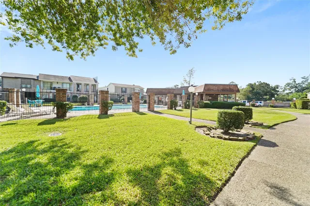 a view of a park with large trees