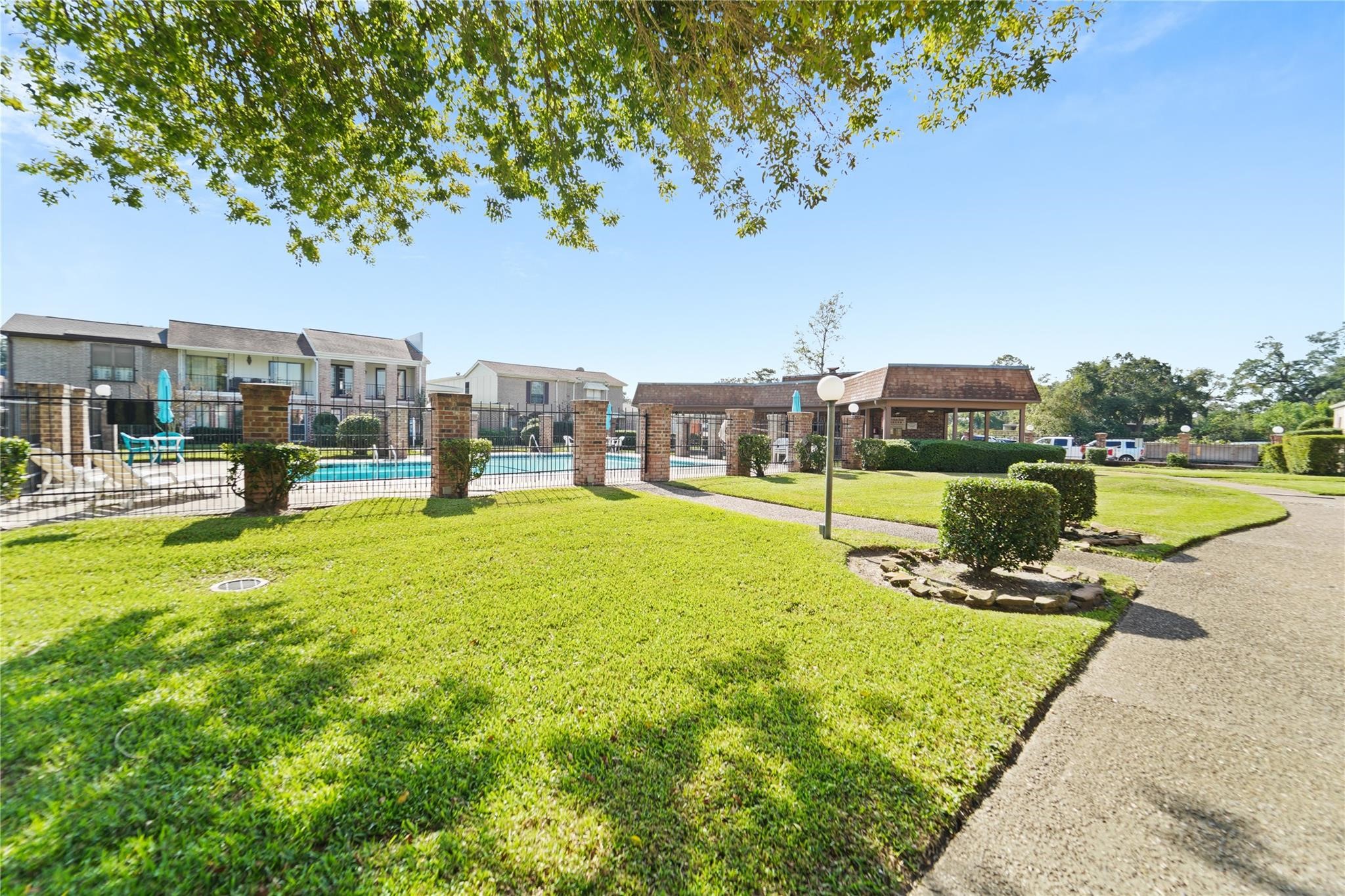 1314 Town Circle, Unit 1 Baytown, TX 77520 - Photo 13 of 17 a view of a park with large trees
