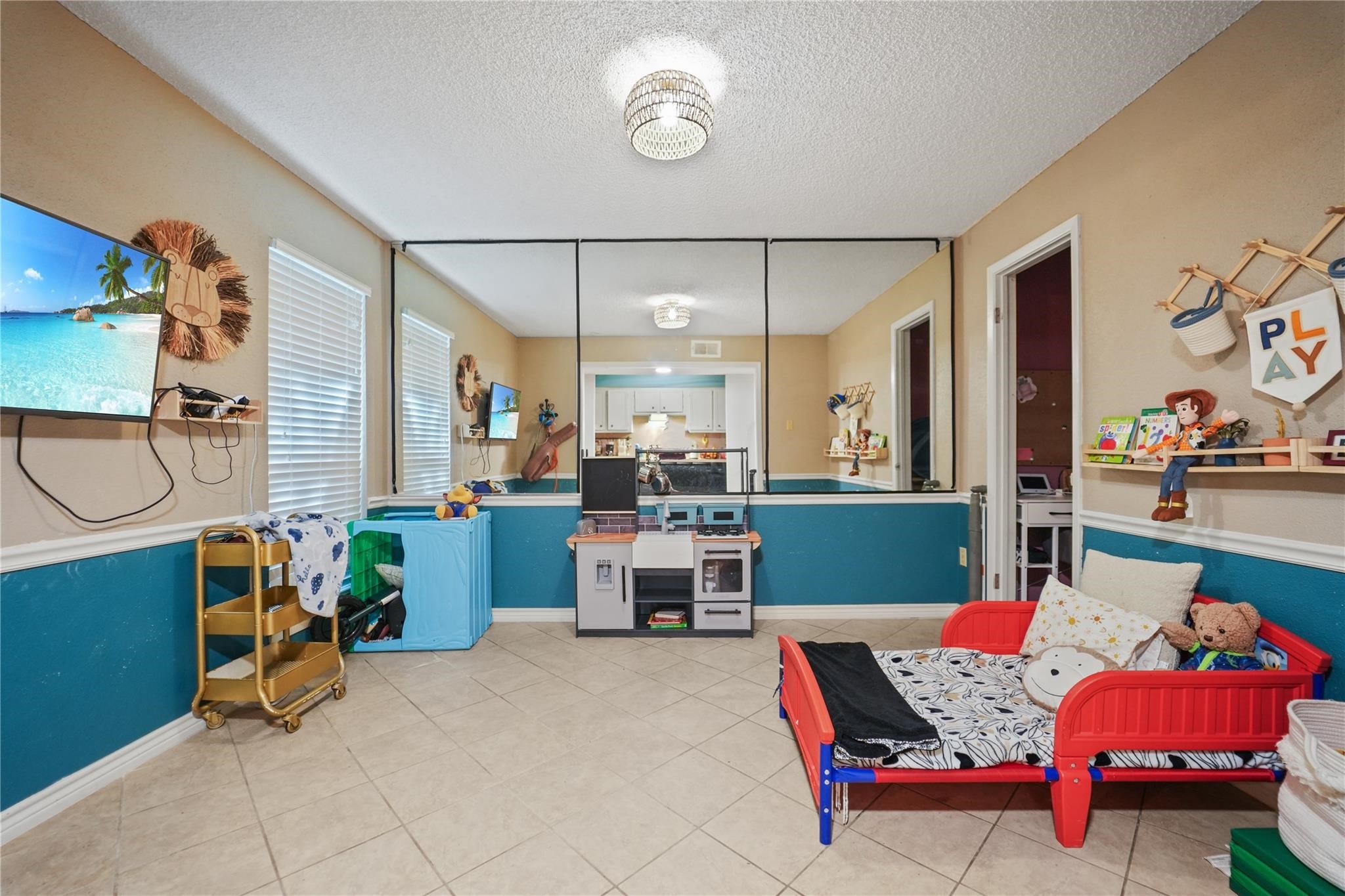 1314 Town Circle, Unit 1 Baytown, TX 77520 - Photo 4 of 17 a bedroom with furniture and a large window