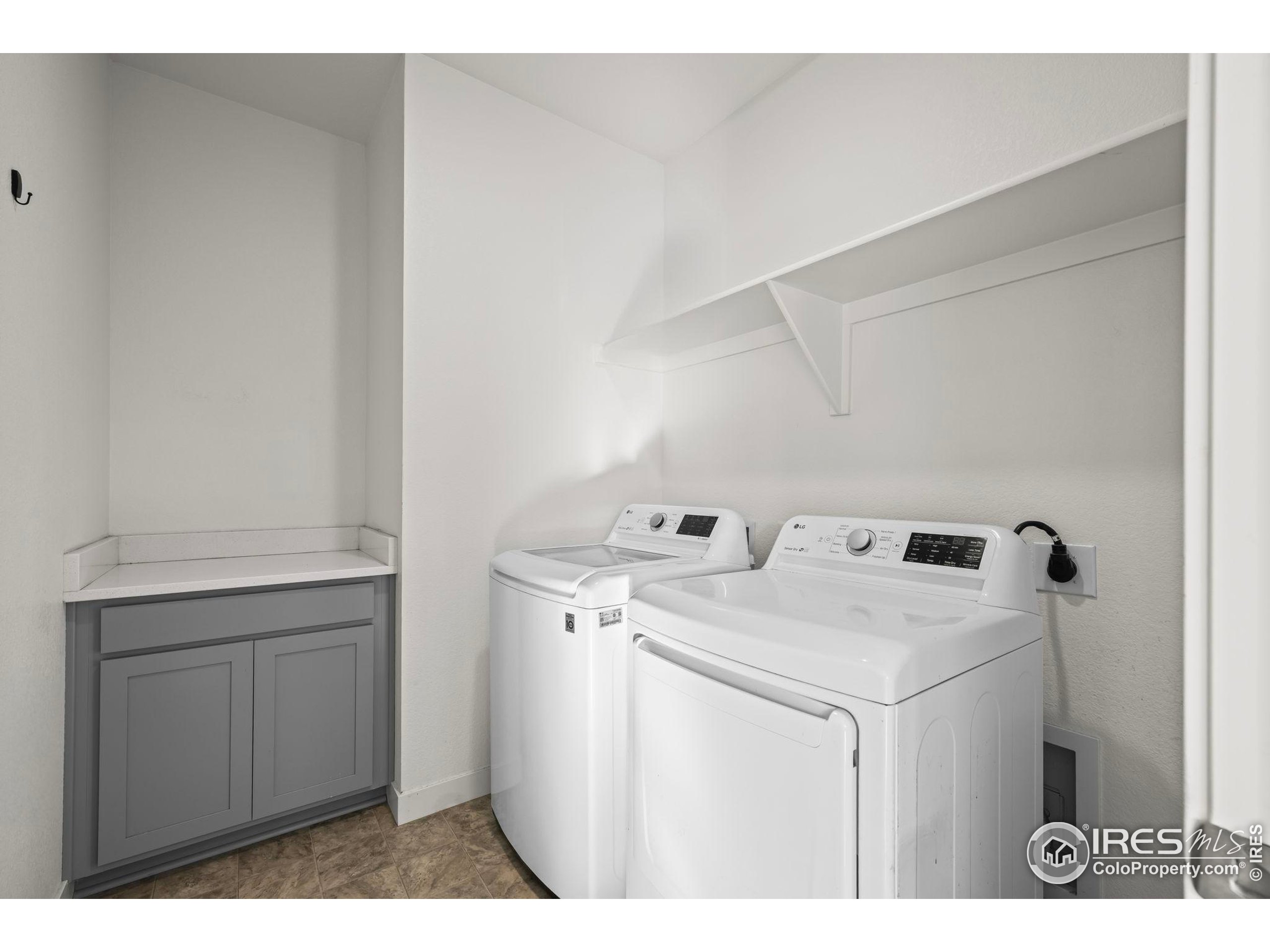 8957 Ferncrest Street Firestone, CO 80504 - Photo 11 of 50 a utility room with dryer and washer