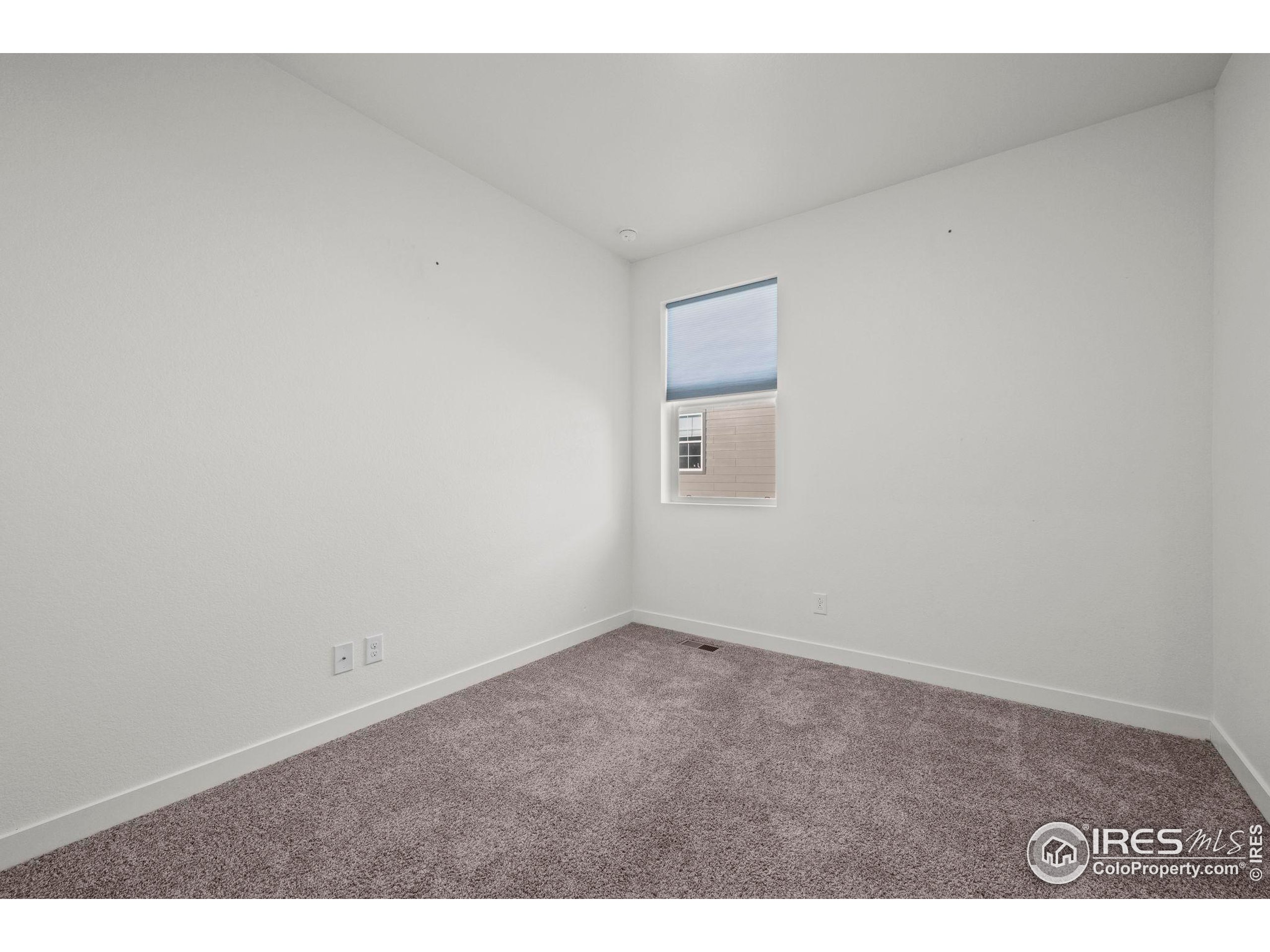 8957 Ferncrest Street Firestone, CO 80504 - Photo 12 of 50 a view of an empty room