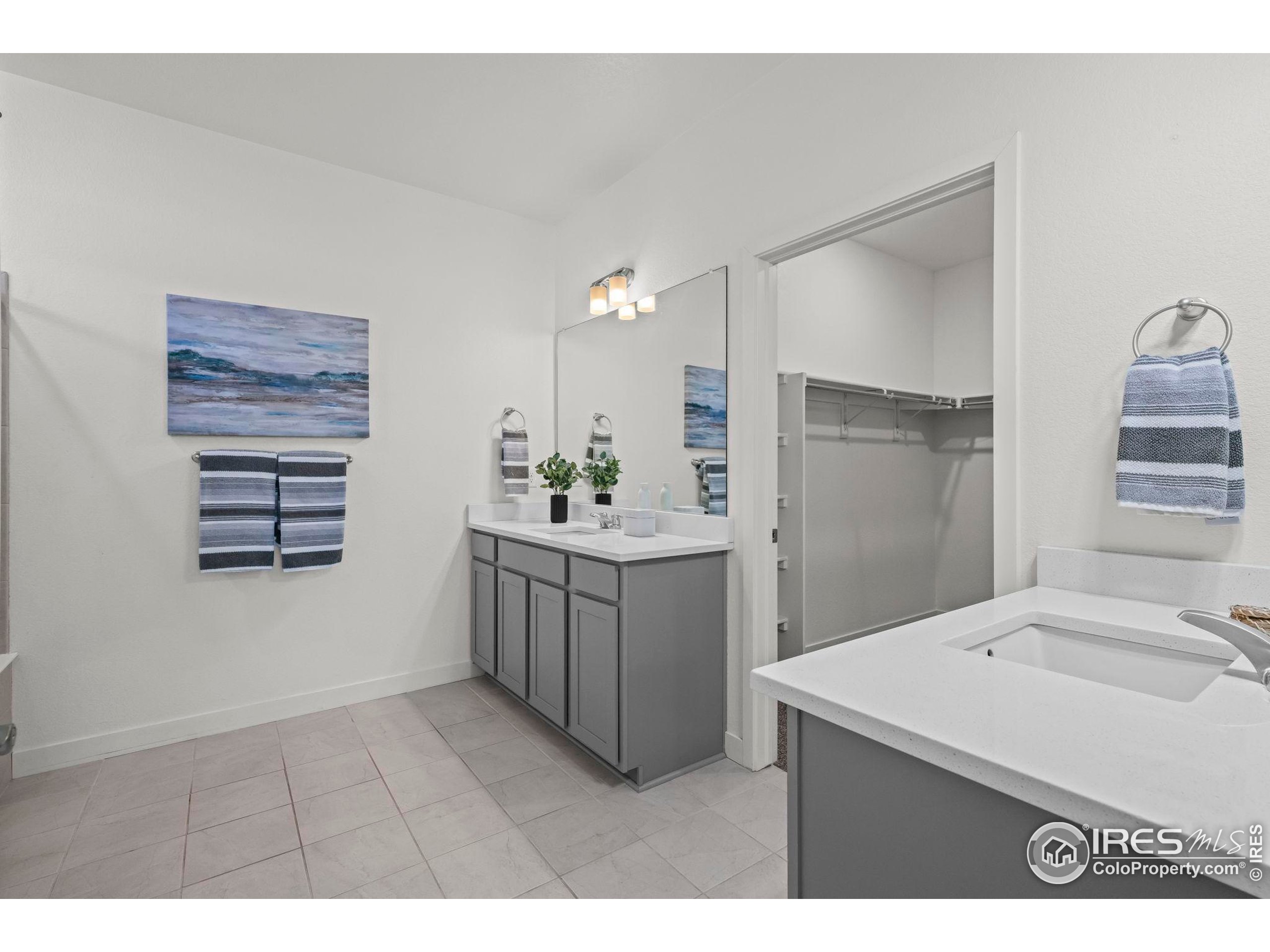 8957 Ferncrest Street Firestone, CO 80504 - Photo 35 of 50 a kitchen with a sink cabinets and appliances