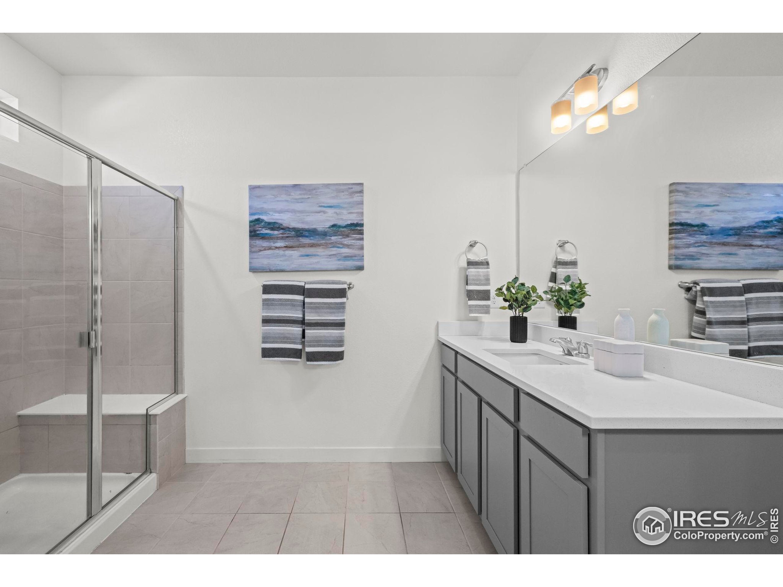 8957 Ferncrest Street Firestone, CO 80504 - Photo 36 of 50 a kitchen with a sink and a mirror