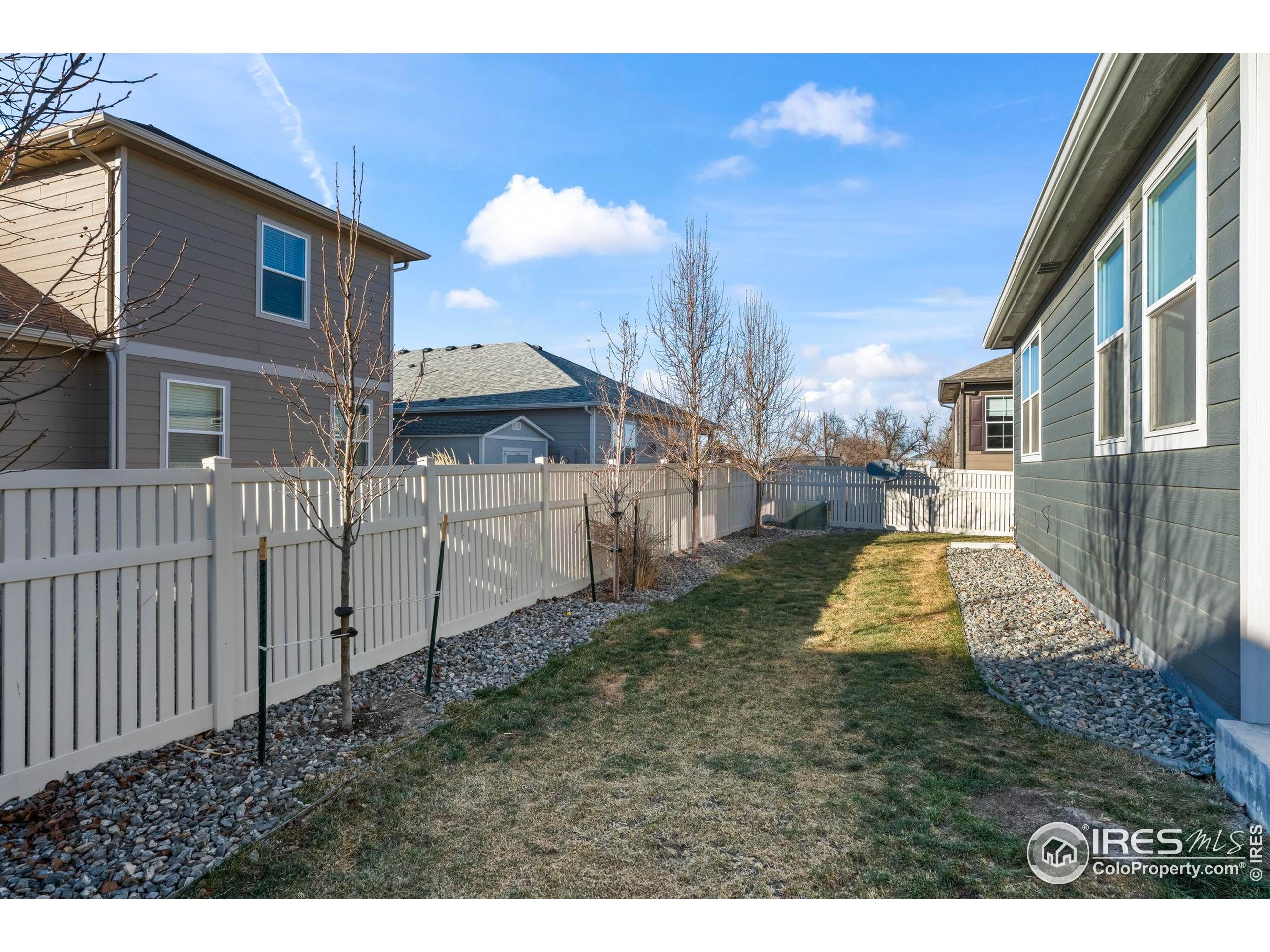 8957 Ferncrest Street Firestone, CO 80504 - Photo 39 of 50 a view of a house with a yard