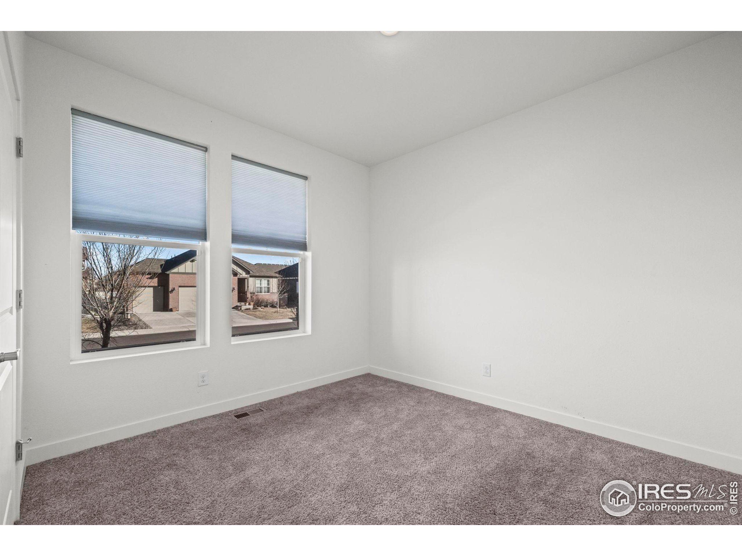 8957 Ferncrest Street Firestone, CO 80504 - Photo 7 of 50 a view of an empty room with a window
