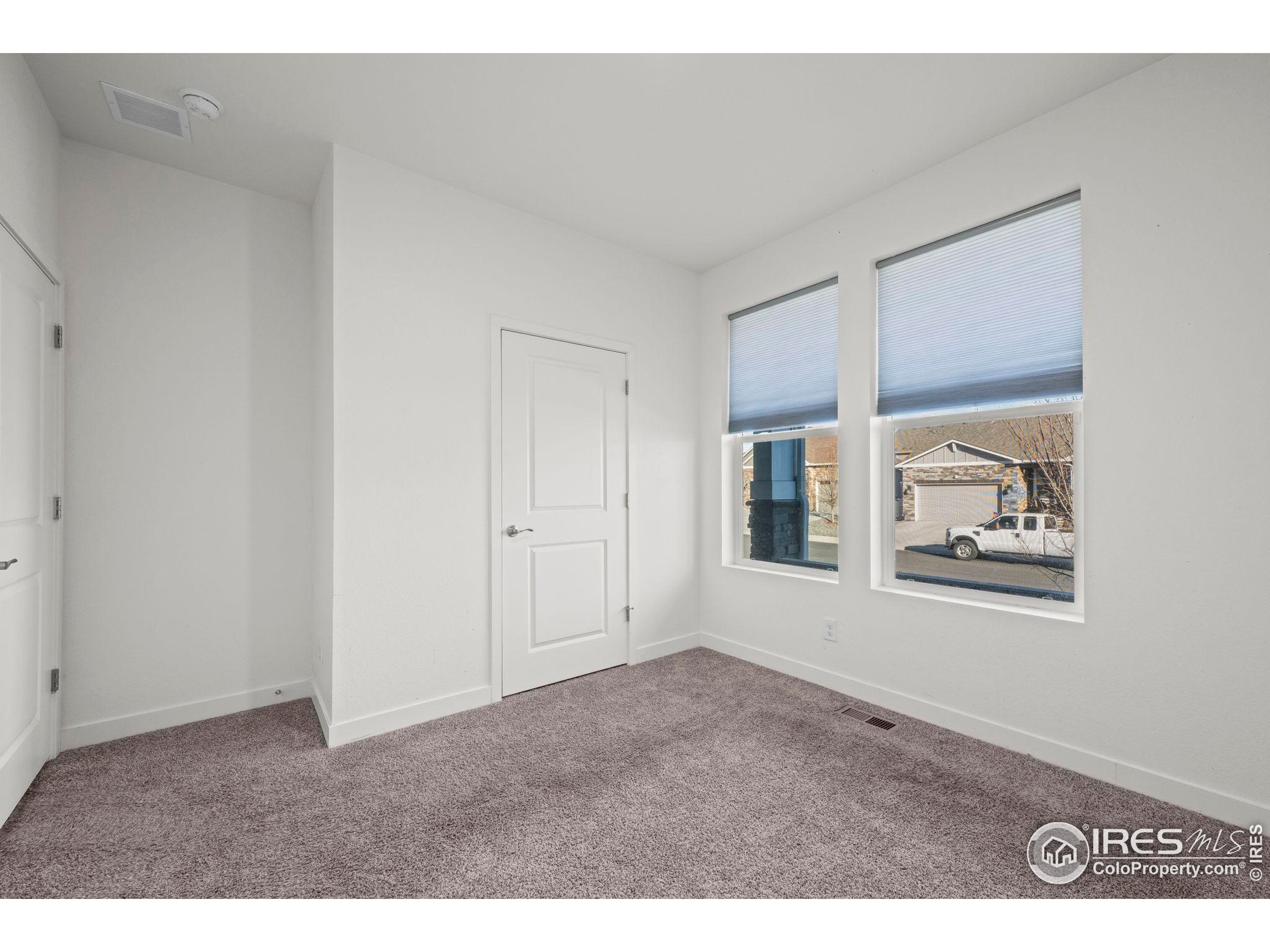 8957 Ferncrest Street Firestone, CO 80504 - Photo 8 of 50 a view of an empty room with closet and window