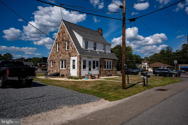 a kitchen with stainless steel appliances granite countertop wooden cabinets a sink and a stove