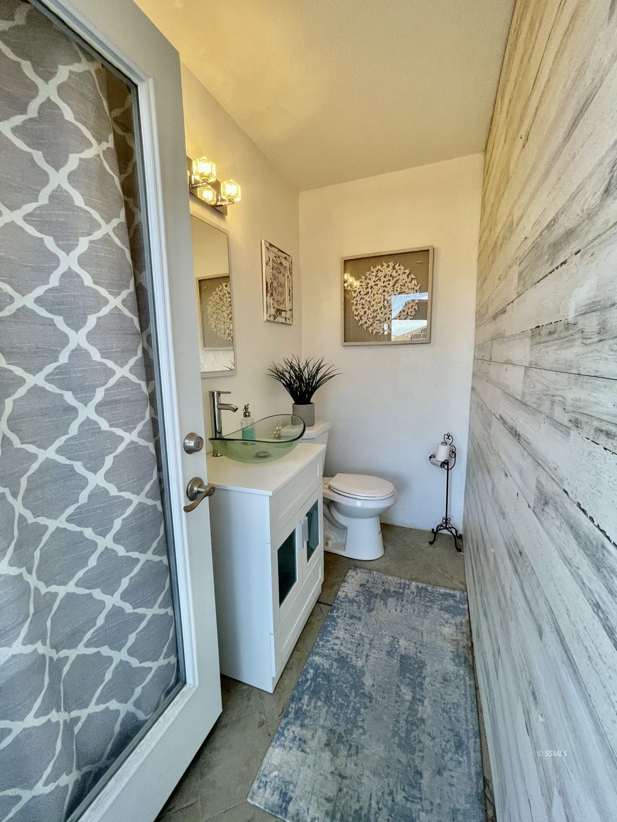 412 Acacia Street Ridgecrest, CA 93555 - Photo 30 of 31 a bathroom with a granite countertop sink toilet and a mirror