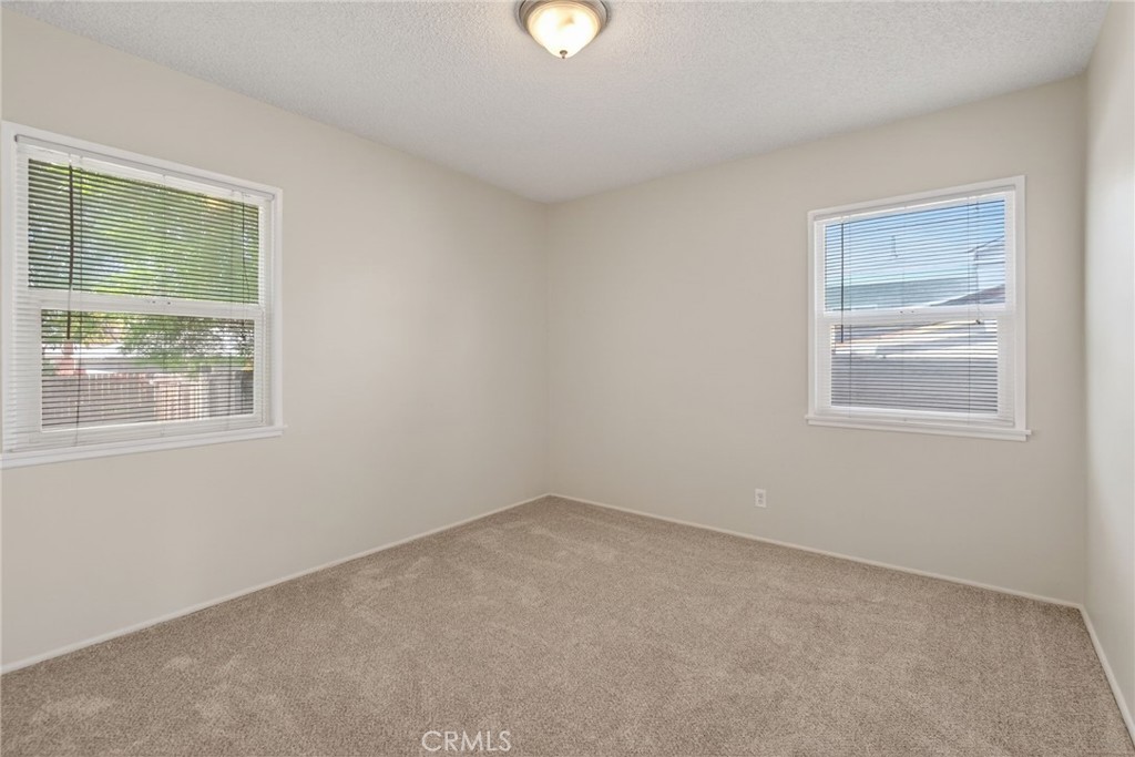 6845 Barcelona Way Riverside, CA 92504 - Photo 12 of 17 Bedroom number 1, brand new carpet and brand new paint.