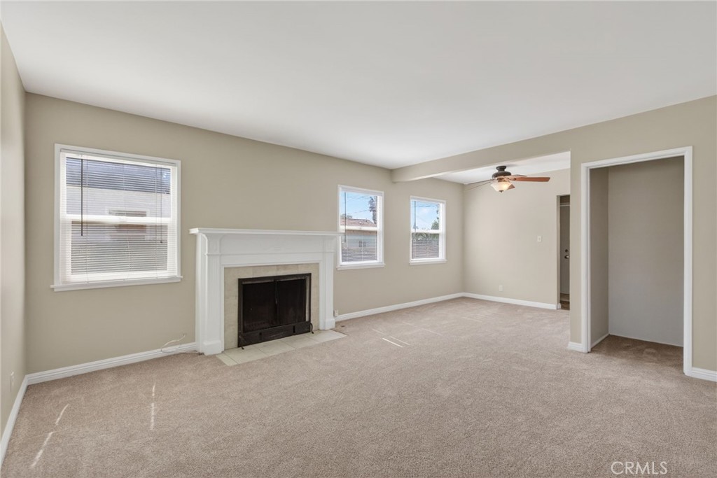 6845 Barcelona Way Riverside, CA 92504 - Photo 5 of 17 View of living room to the dining area with ceiling fan just off the kitchen.