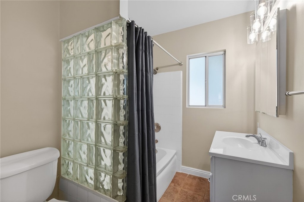 6845 Barcelona Way Riverside, CA 92504 - Photo 10 of 17 Glass block in the bathroom, with newer vanity