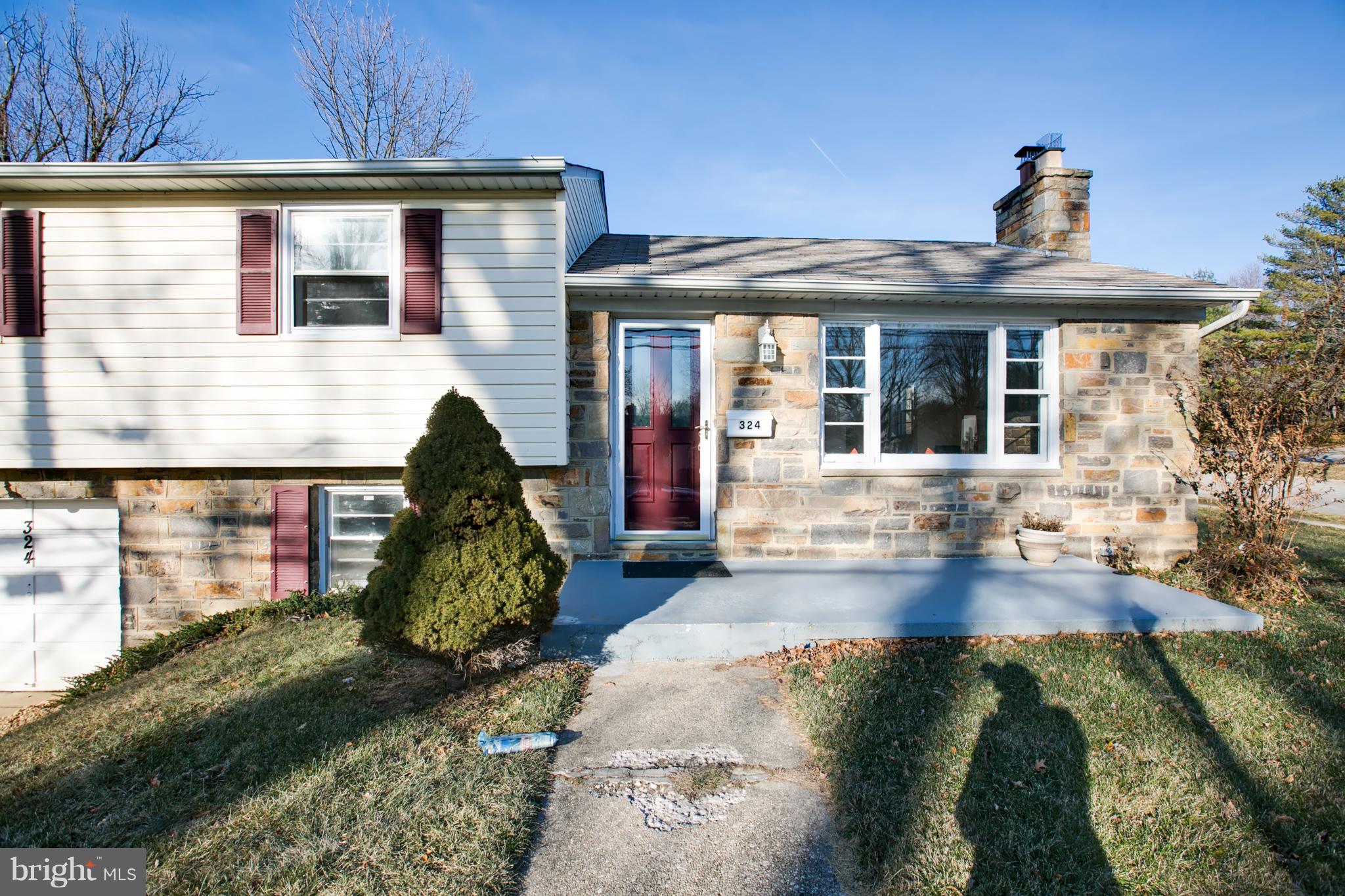 324 Aigburth Road Towson, MD 21286 - Photo 2 of 29 a front view of a house with a yard