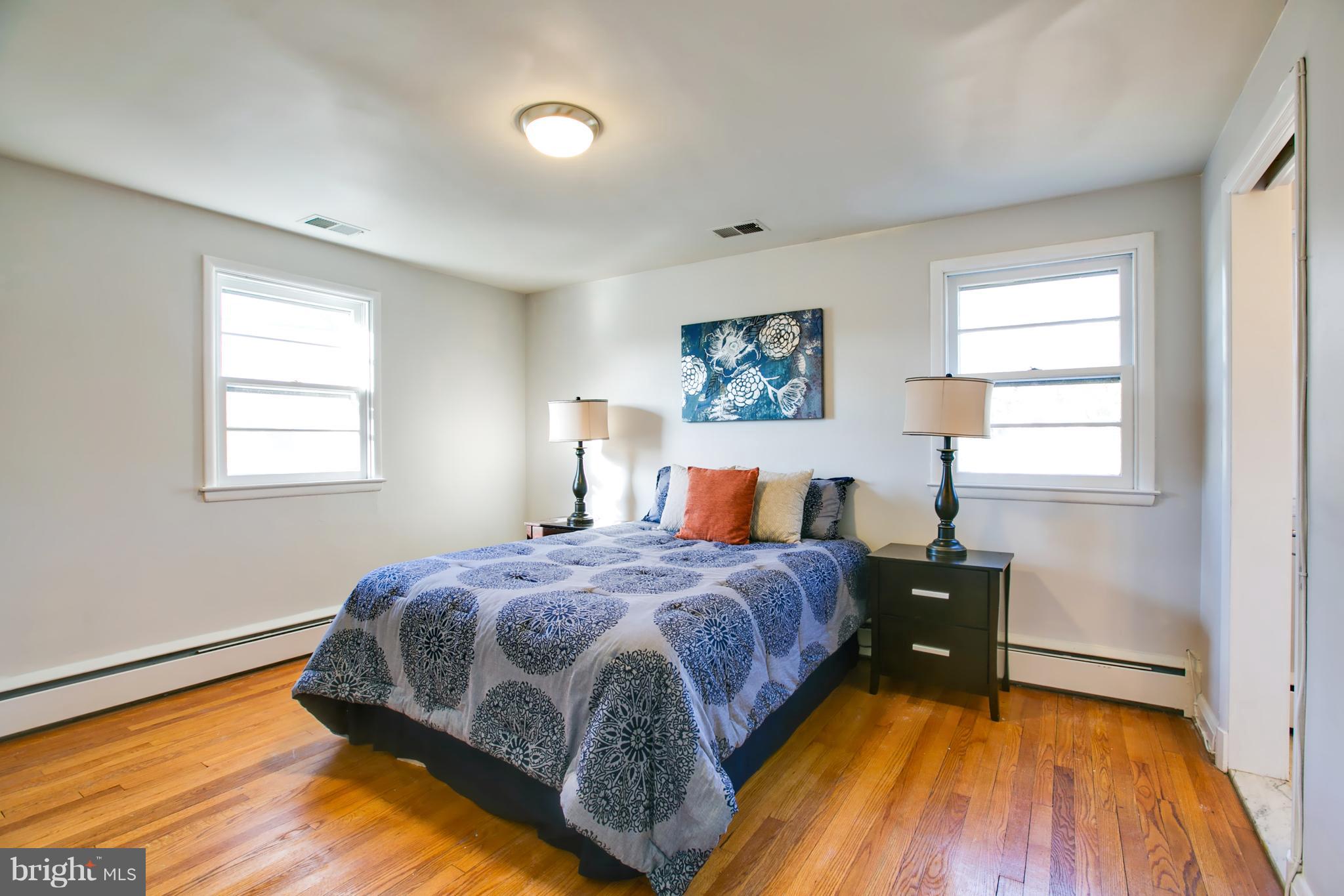 324 Aigburth Road Towson, MD 21286 - Photo 16 of 29 a bed sitting in a bedroom next to a window