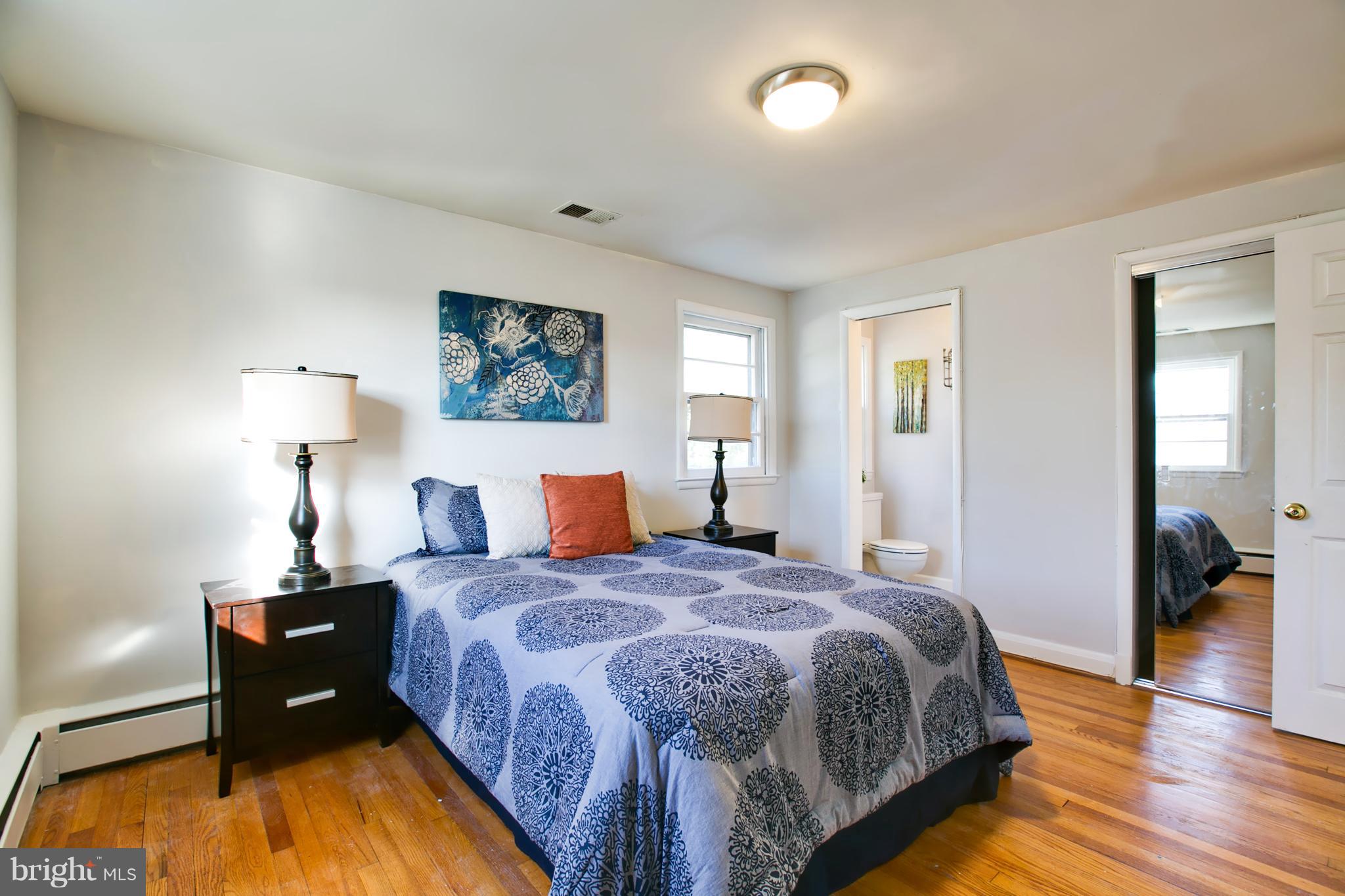324 Aigburth Road Towson, MD 21286 - Photo 17 of 29 a bedroom with a bed and a couch
