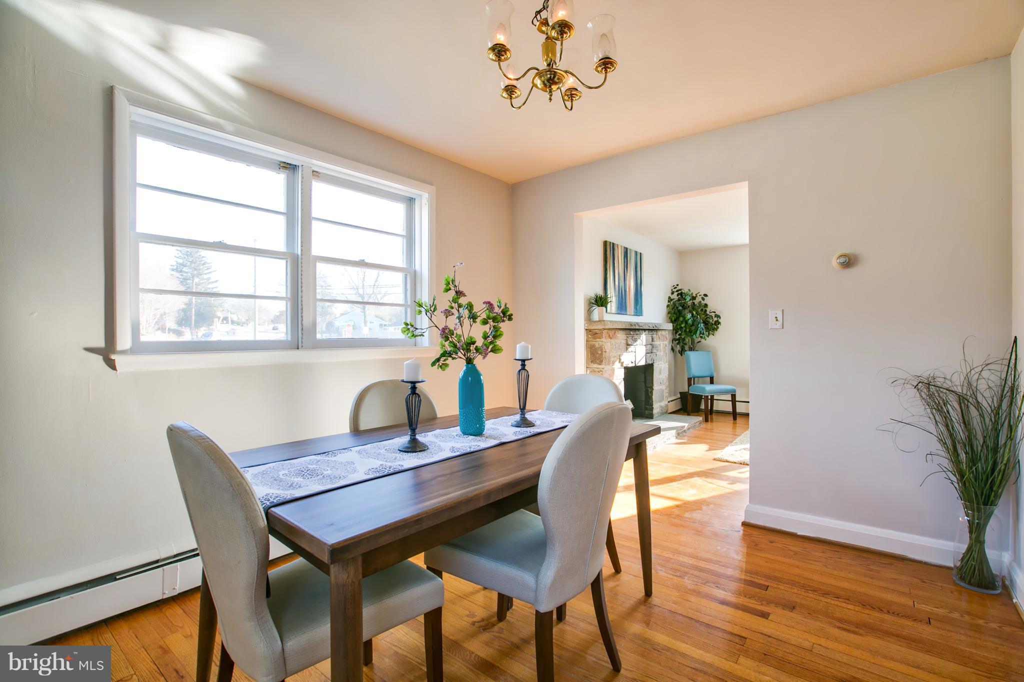324 Aigburth Road Towson, MD 21286 - Photo 8 of 29 a dining room with furniture potted plants and wooden floor