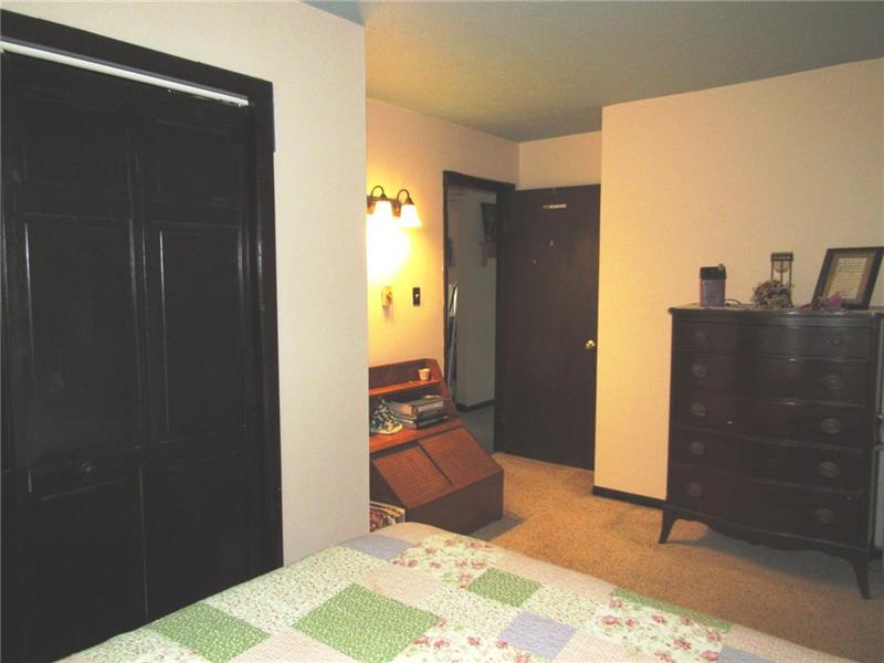 207 Clinton Road Normalville, PA 15469 - Photo 14 of 25 What's great about this room is how close it is to the kitchen! Easy to get to the fridge for late night snacks. OK it's also nice to have for bad knees and hips! Second floor is next!