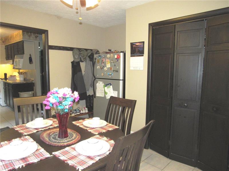 207 Clinton Road Normalville, PA 15469 - Photo 5 of 25 Here's the other side of the dining room. Behind the bi-fold doors you'll find storage space.