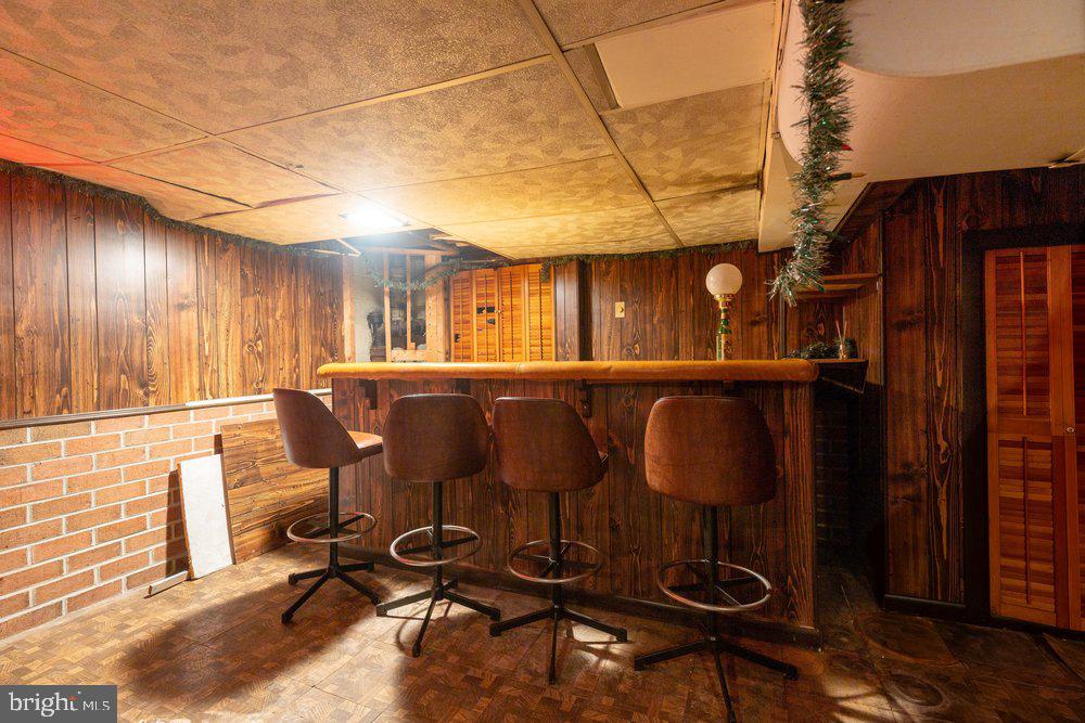 1120 Fairview Road Hagerstown, MD 21742 - Photo 5 of 39 Cozy retro bar with warm wood tones.