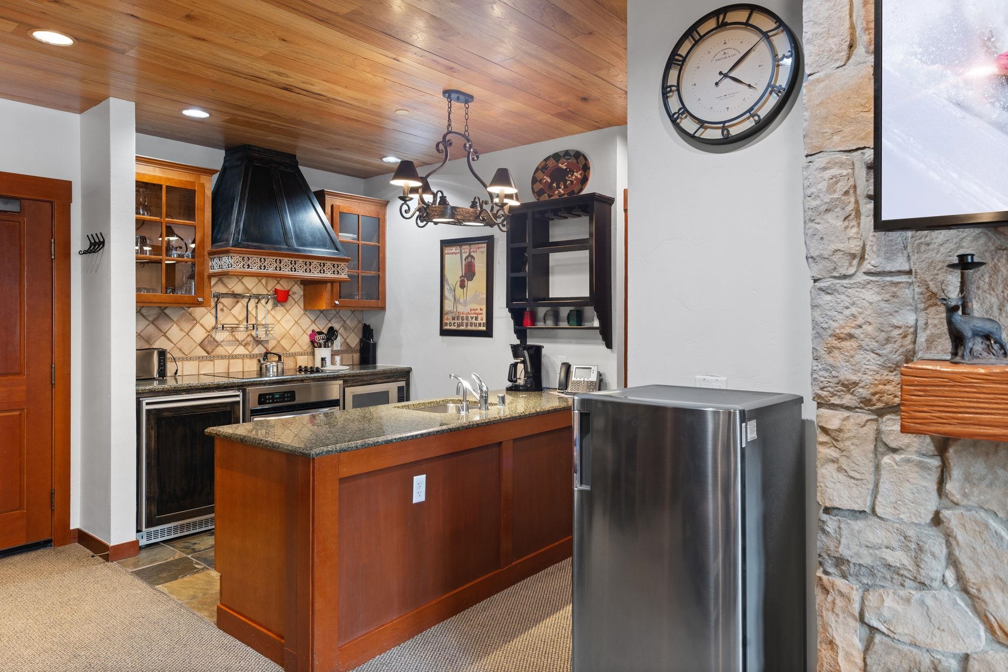 1985 Olympic Vly Road, Unit 216 (2216) Olympic Valley, CA 96146 - Photo 13 of 25 a kitchen with stainless steel appliances granite countertop a stove and a sink