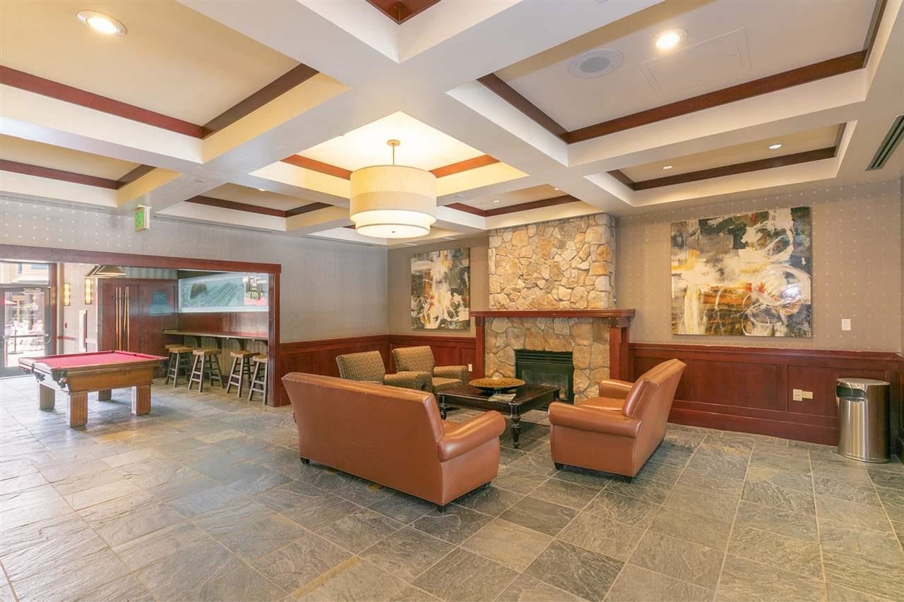 1985 Olympic Vly Road, Unit 216 (2216) Olympic Valley, CA 96146 - Photo 25 of 25 a living room with furniture and a fireplace