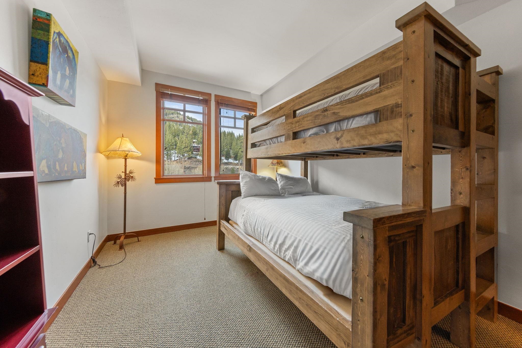 1985 Olympic Vly Road, Unit 216 (2216) Olympic Valley, CA 96146 - Photo 5 of 25 a bedroom with a bed and windows