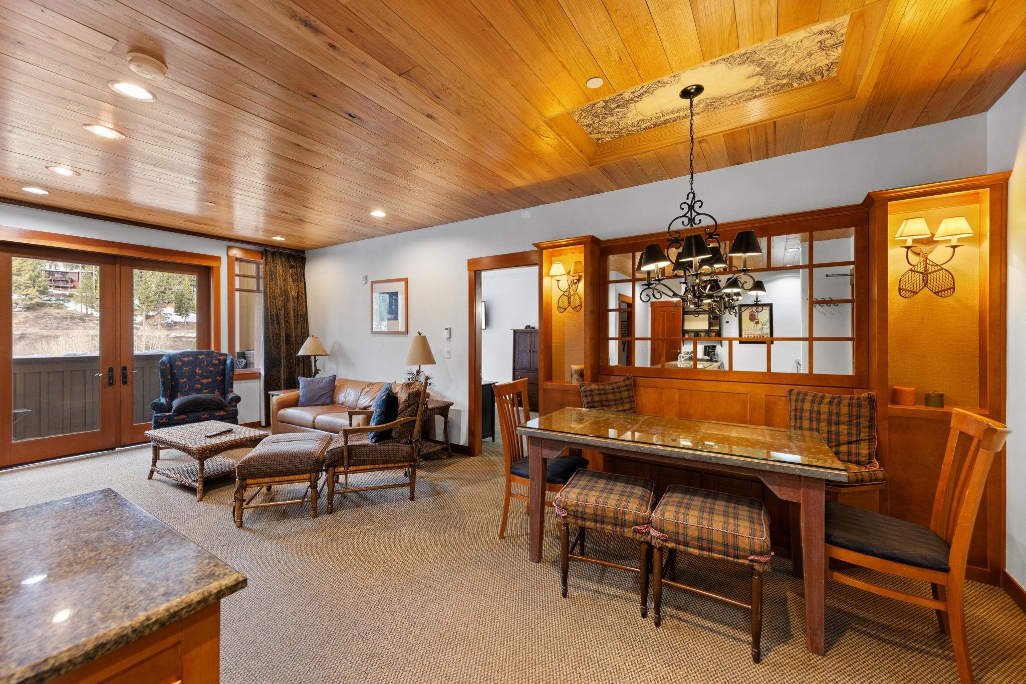 1985 Olympic Vly Road, Unit 216 (2216) Olympic Valley, CA 96146 - Photo 6 of 25 a living room with furniture a window and a ceiling fan