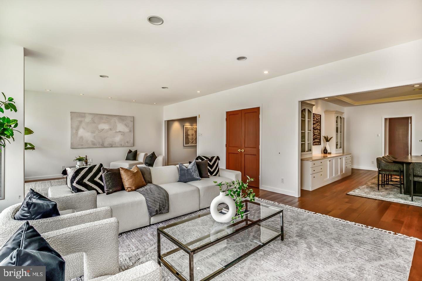 1820 Rittenhouse Square, Unit 1601 Philadelphia, PA 19103 - Photo 15 of 53 a living room with furniture a rug and a flat screen tv
