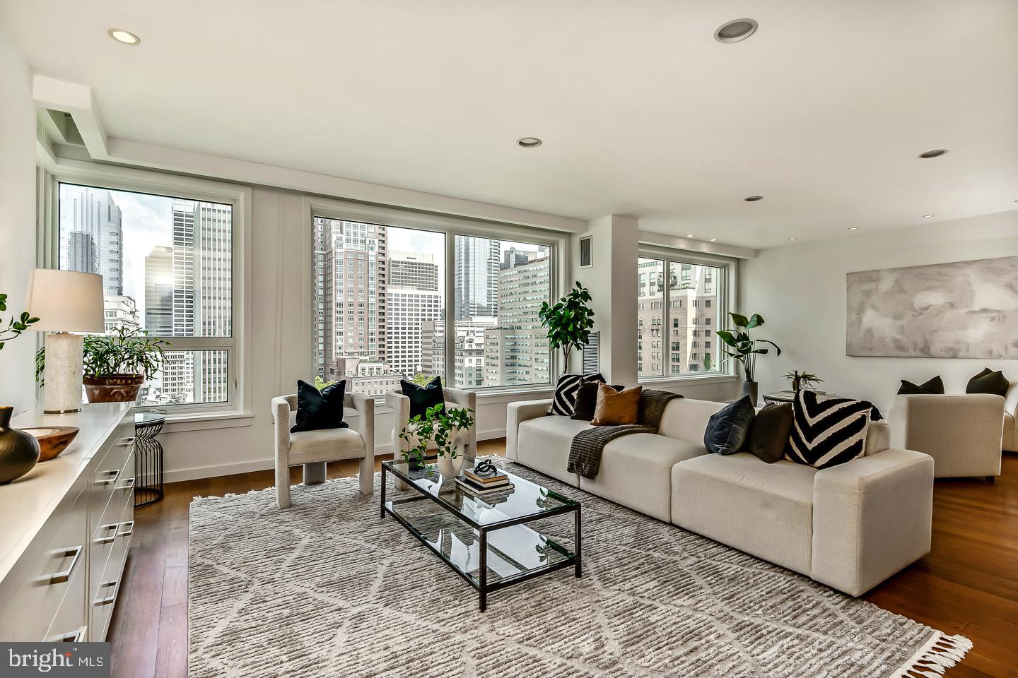1820 Rittenhouse Square, Unit 1601 Philadelphia, PA 19103 - Photo 18 of 53 a living room with furniture and large windows