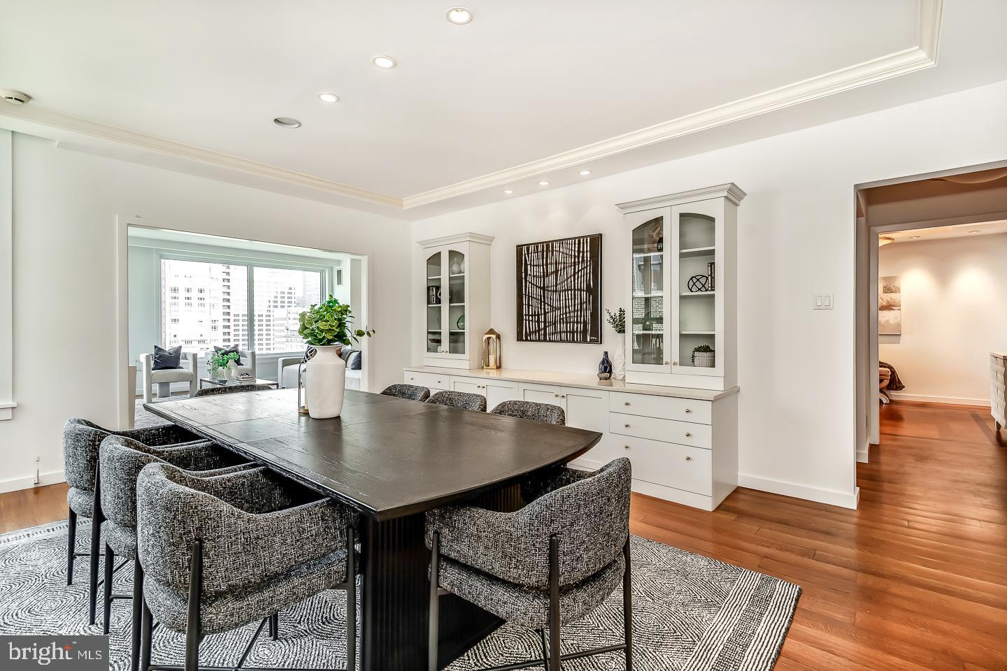 1820 Rittenhouse Square, Unit 1601 Philadelphia, PA 19103 - Photo 20 of 53 a dining room with wooden floor and large windows
