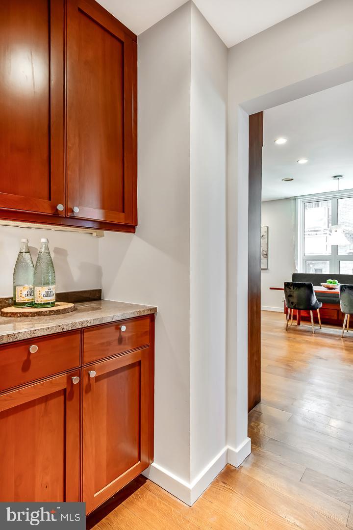 1820 Rittenhouse Square, Unit 1601 Philadelphia, PA 19103 - Photo 25 of 53 a view of a kitchen with kitchen island a counter top space and cabinets