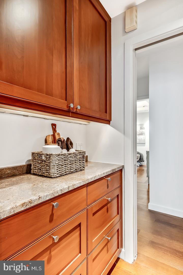 1820 Rittenhouse Square, Unit 1601 Philadelphia, PA 19103 - Photo 26 of 53 a kitchen with granite countertop cabinets and utility room