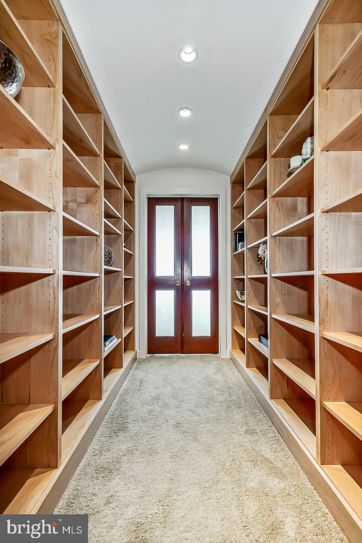 1820 Rittenhouse Square, Unit 1601 Philadelphia, PA 19103 - Photo 29 of 53 a view of an empty room with empty shelves and a window