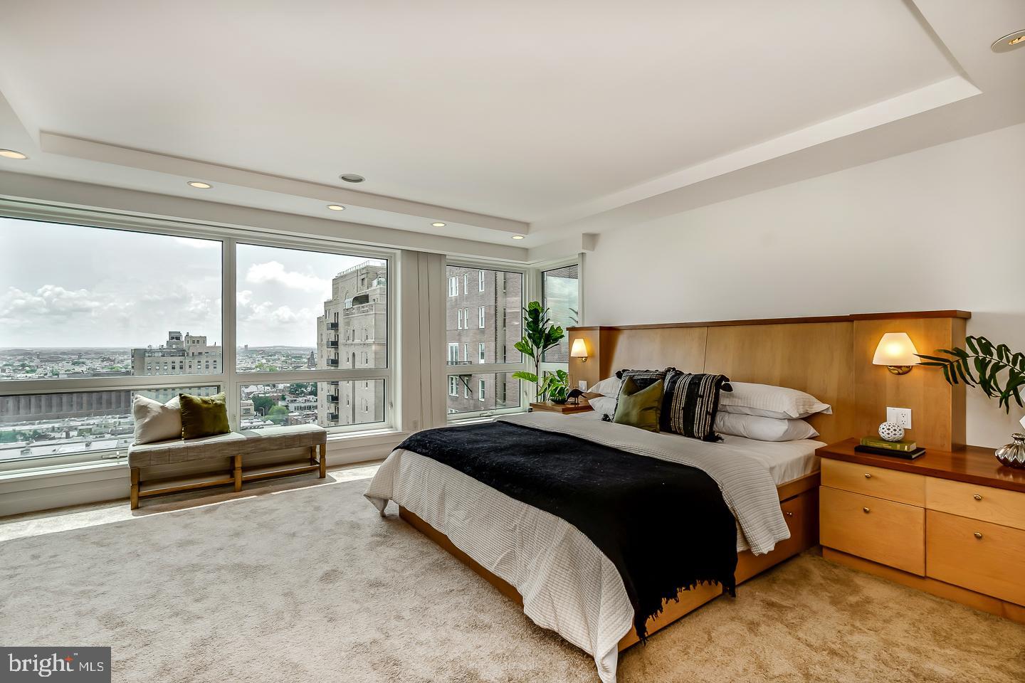 1820 Rittenhouse Square, Unit 1601 Philadelphia, PA 19103 - Photo 31 of 53 a spacious bedroom with a bed and large windows