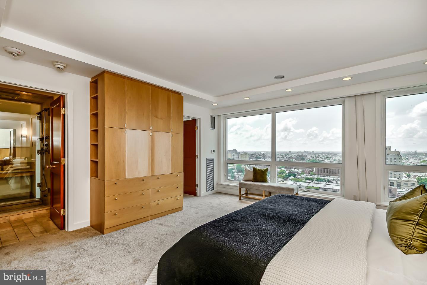 1820 Rittenhouse Square, Unit 1601 Philadelphia, PA 19103 - Photo 33 of 53 a bedroom with a bed and large windows