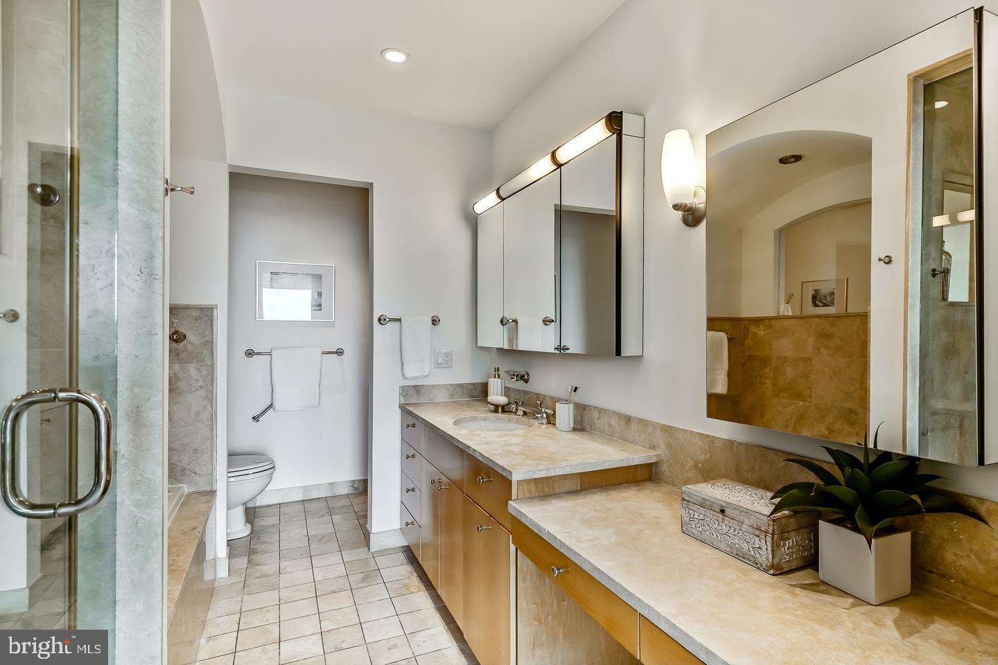 1820 Rittenhouse Square, Unit 1601 Philadelphia, PA 19103 - Photo 42 of 53 a bathroom with a sink double vanity and a mirror
