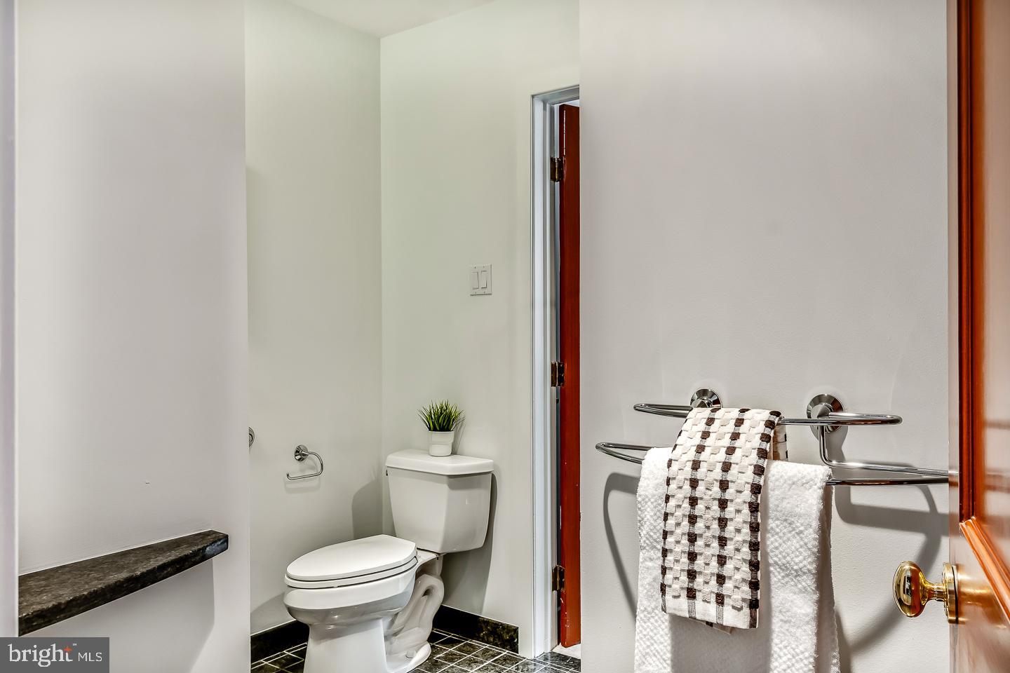 1820 Rittenhouse Square, Unit 1601 Philadelphia, PA 19103 - Photo 48 of 53 a bathroom with a toilet and a shower curtain