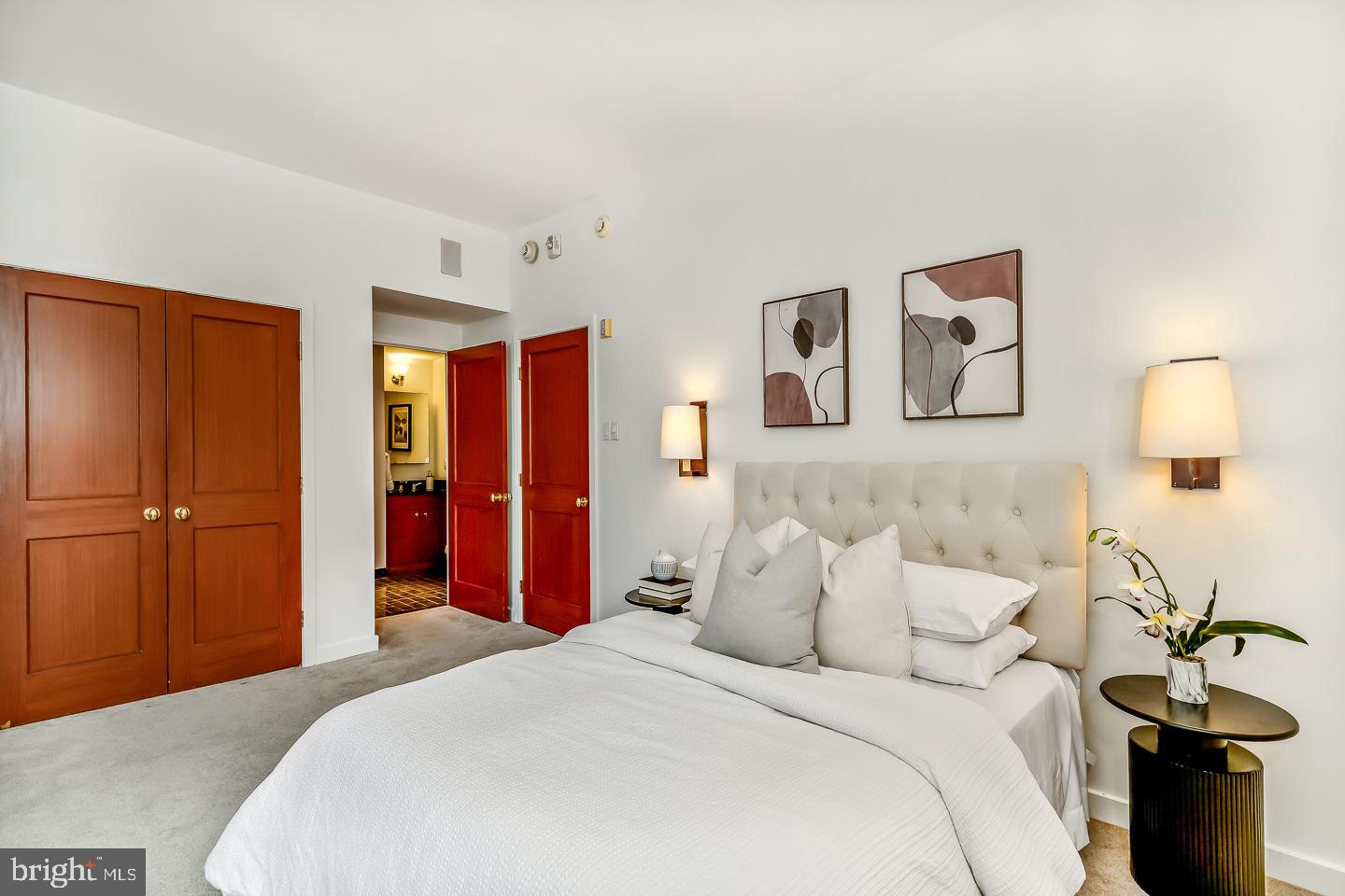 1820 Rittenhouse Square, Unit 1601 Philadelphia, PA 19103 - Photo 50 of 53 a bedroom with a bed and a lamp