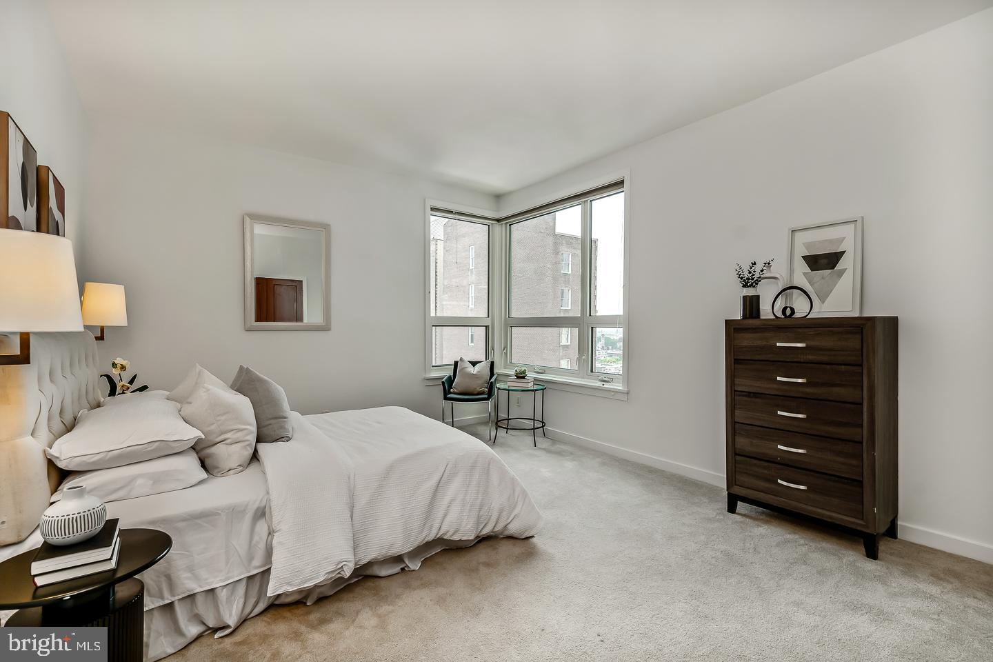 1820 Rittenhouse Square, Unit 1601 Philadelphia, PA 19103 - Photo 52 of 53 a bedroom with a bed and a window