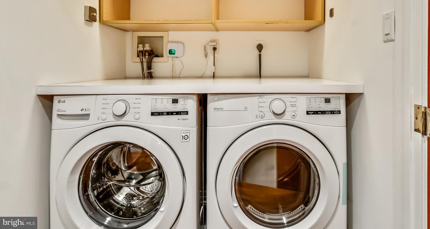 1820 Rittenhouse Square, Unit 1601 Philadelphia, PA 19103 - Photo 53 of 53 a utility room with dryer and washer