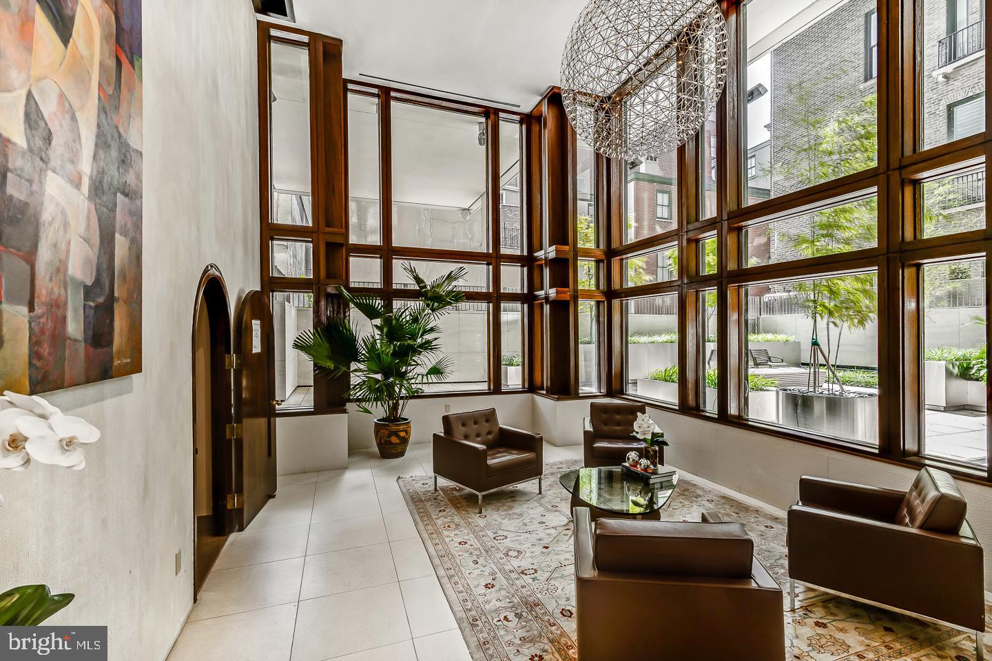 1820 Rittenhouse Square, Unit 1601 Philadelphia, PA 19103 - Photo 7 of 53 a living room with furniture and a floor to ceiling window