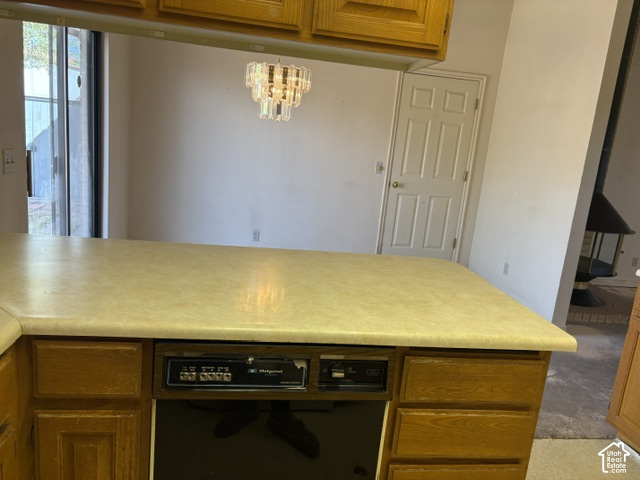 2164 West 2000 North St. George, UT 84770 - Photo 11 of 26 Kitchen island with a laminate countertop and built-in dishwasher