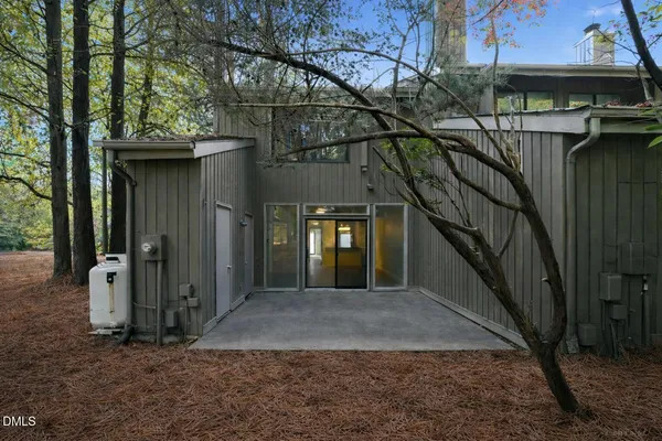 a view of a house with a tree